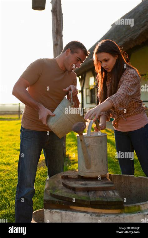 Pouring Water Bucket High Resolution Stock Photography And Images Alamy
