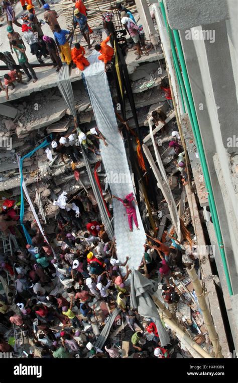 Bangladeshi People Gather As Rescuers Look For Survivors And Victims At The Site Of Rana Plaza