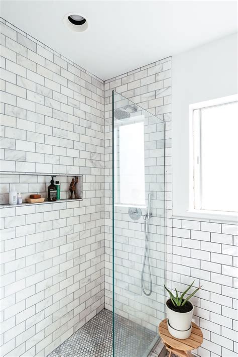 The Marble Subway Tile That Lines The Walls Of The Shower In This