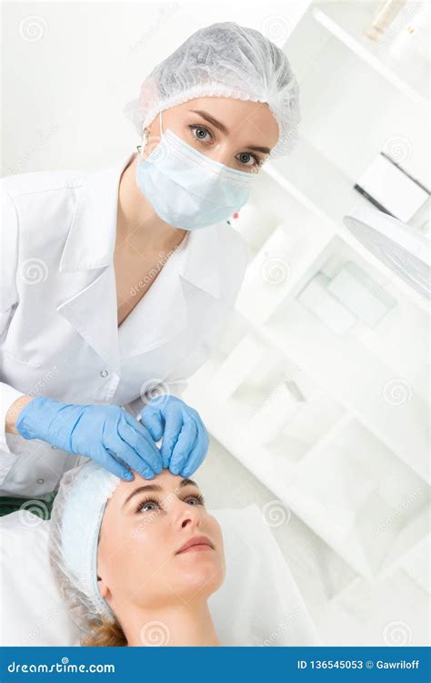 Female Beautician Doctor With Patient In Wellness Center Professional