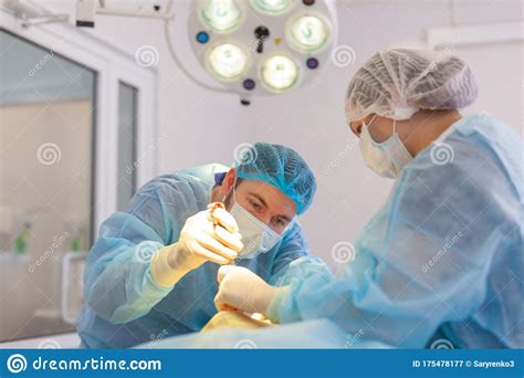 Hospital Surgeon Operates In The Operating Room Preparations Before