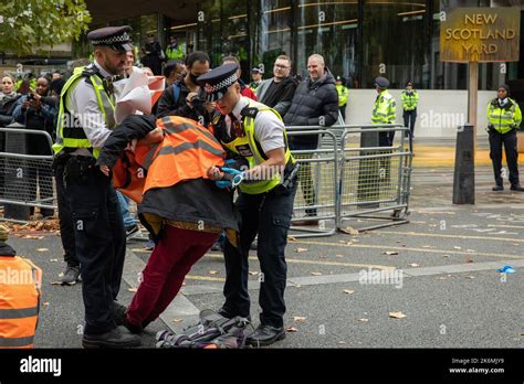 London, UK. 14th October, 2022. Metropolitan Police officers arrest a