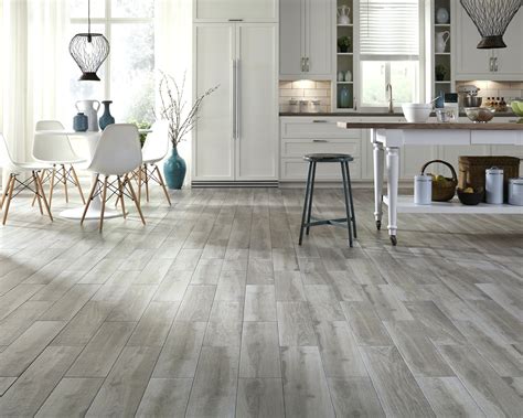 Wood grain tiles with more features, like textures or advanced printing can cost a little more. Image result for dark wood look floors | Gray wood tile ...
