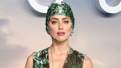 Amber Heard Wears Fashion Forward Swim Cap At Aquaman Premiere