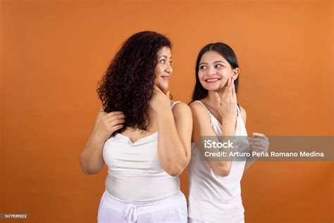 Women Touching Each Others Skin And Seeing Each Other Happily Stock