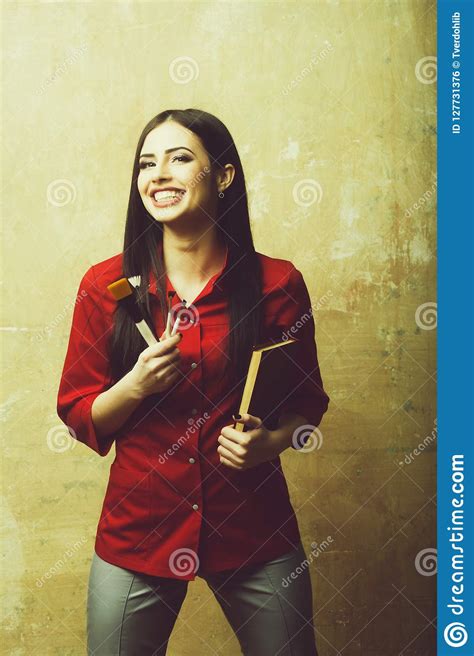 Pretty Brunette Smiling Woman With Brush Set And Notebook