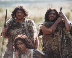 Three Men Dressed In Fur And Holding Spears