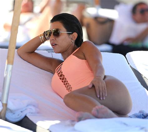 Kourtney Flaunts Famous Kardashian Booty In Plunging Swimsuit Daily Star