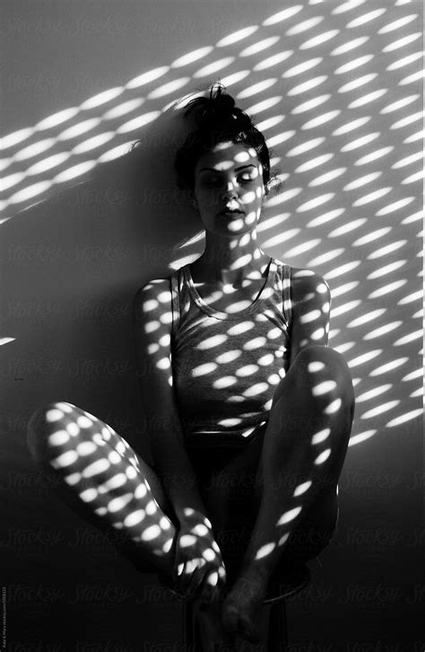 Portrait Of Beautiful Woman With Light On Her Skin Del Colaborador De Stocksy Katarina