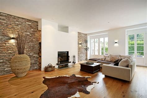 The Interior Of A Living Room In Brown Color Features Photos Of