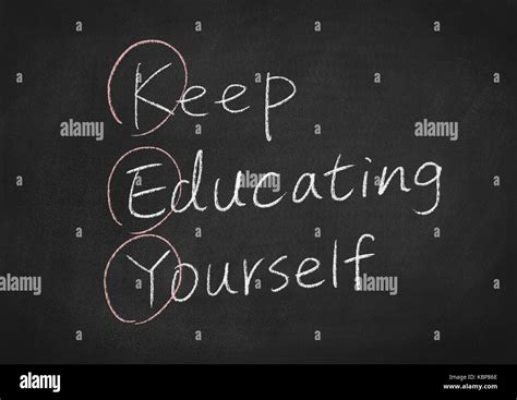 Keep Educating Yourself Concept Words On A Blackboard Background Stock