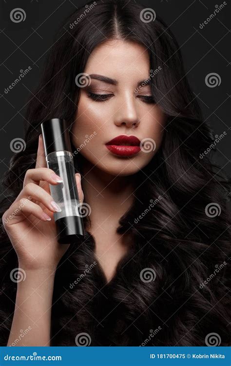 Beautiful Brunette Model Curls Classic Makeup And Red Lips With A