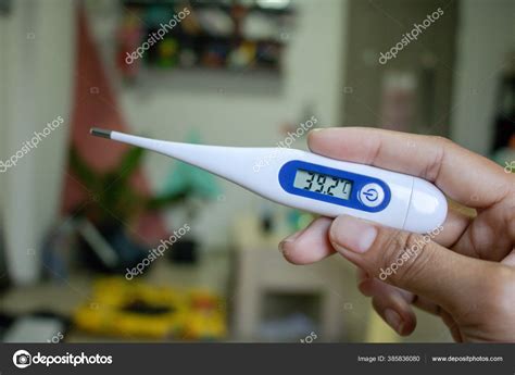Hand Holding Thermometer High Fever Temperature More Celsius Check Body
