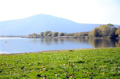 Panorama Of Lago Di Vico With The Green Shore The Autumnal Trees