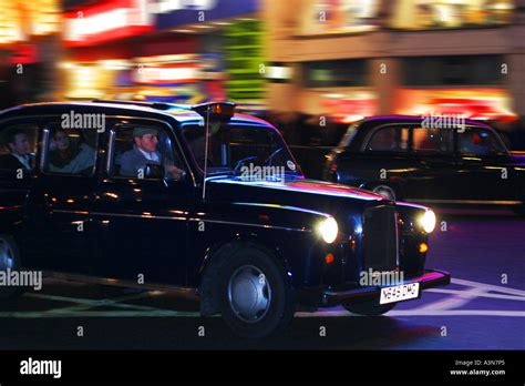 London Taxi Cab At Night Stock Photo Alamy