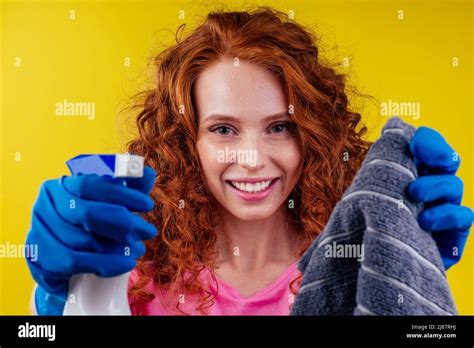 Good Looking Redhair Curly Ginger Pterry Woman Holding Spray And