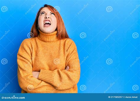 Beautiful Redhead Woman With Arms Crossed Gesture Angry And Mad