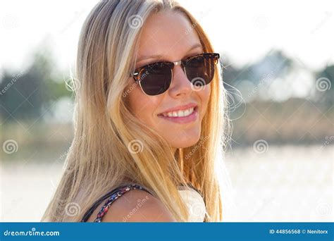 Young Attractive Woman With Sunglasses On A Summer Day Stock Photo