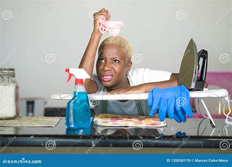 Young Attractive Stressed And Upset Back Afro American Woman In Washing Rubber Gloves Cleaning
