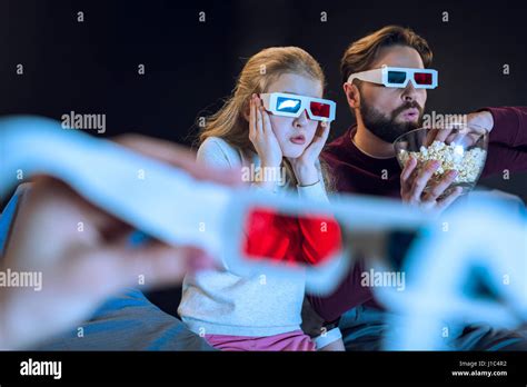 Shocked Father And Daughter In 3d Glasses Watching Movie And Eating