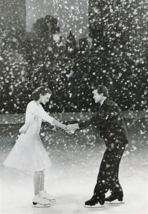 Cute Couple Ice Skating In The Snow
