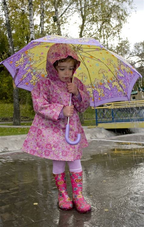 Little Girl With Yellow Umbrella Playing In Rain 2 Stock Image Image
