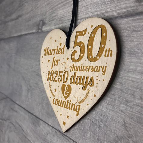 A wedding anniversary is the anniversary of the date a wedding took place. 50th Wedding Anniversary Wood Heart Gift Gold Fifty Years ...
