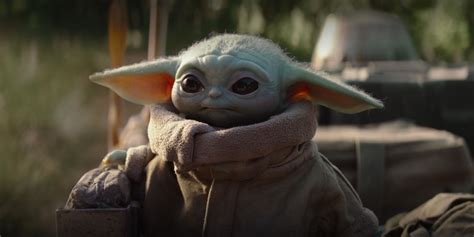 Dwayne Johnson Snuggles The Mandalorians Baby Yoda In Fan Art