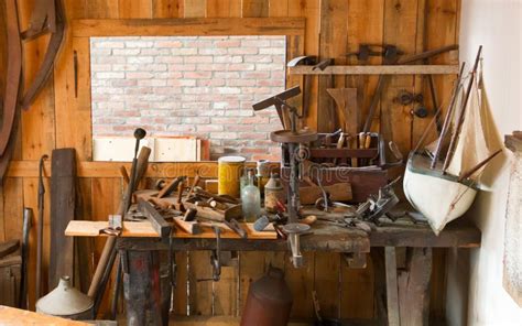 Collection Of Vintage Woodworking Tools On A Rough Workbench Stock