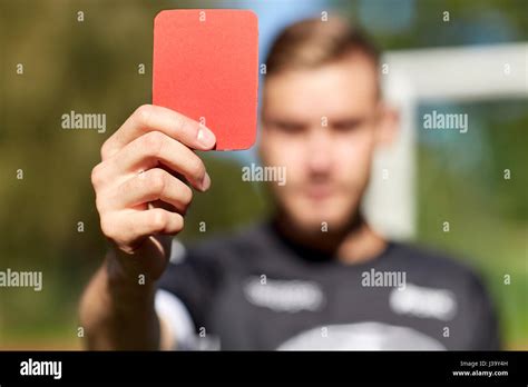 Referee Hands With Red Card On Football Field Stock Photo Alamy