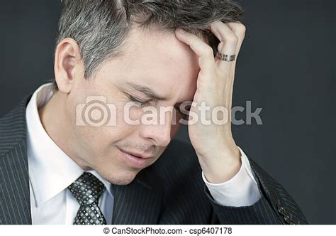 Stressed Businessman Holds Head In Hand Close Up Of A Stressed D06