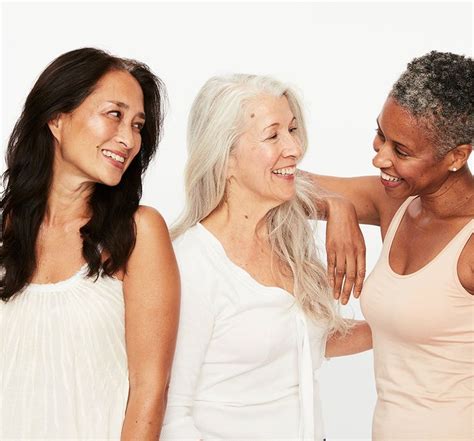Three Women Standing Next To Each Other In Front Of A White Background