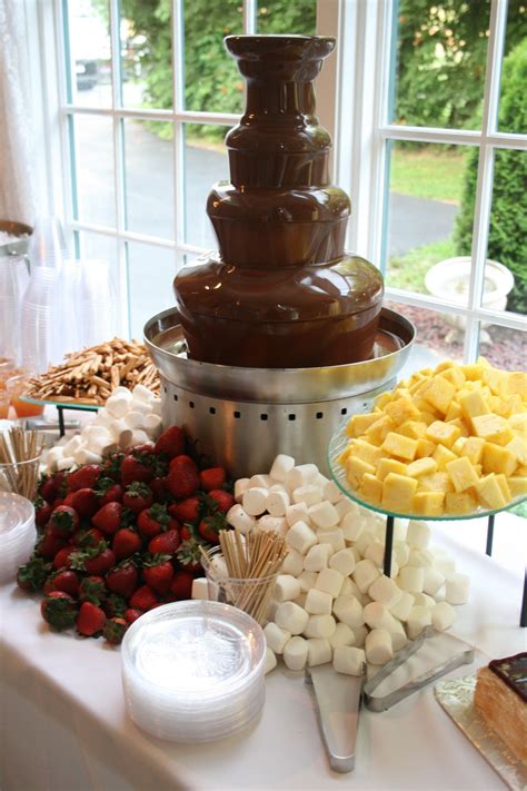 Chocolate Fountain With Marshmallows Strawberries Pretzels And More