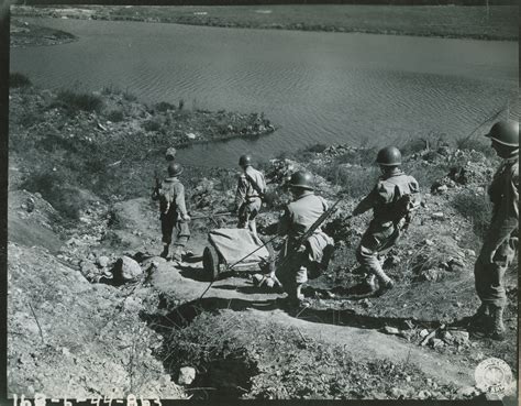 81st Infantry Division Soldiers Using Hand Cart To Walk Munitions
