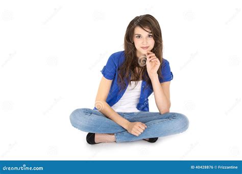 Isolated Young Smiling Teenager Sitting With Crossed Legs Stock Photo