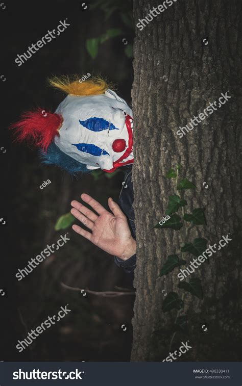 Scary Clown Behind Tree Wave Gesture Stock Photo 490330411 Shutterstock