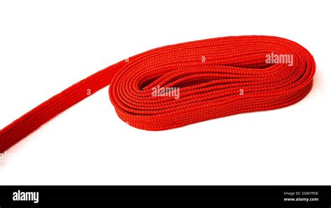 Red Rope On White Background Fabric Rope In Red Color Folded In A Coil