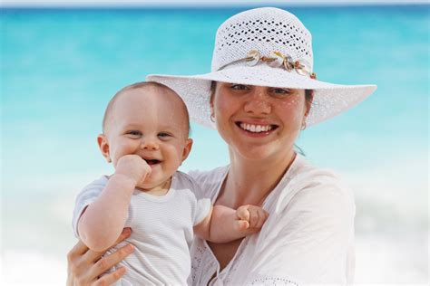 Mother And Baby On The Beach Free Stock Photo Public Domain Pictures