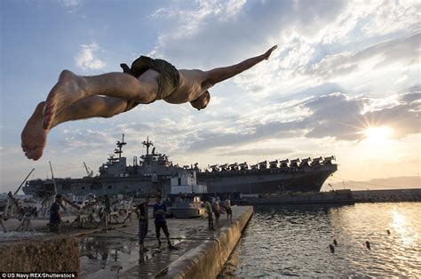 Us Navy Sailors Leap From Ships Around The World During Swim Call