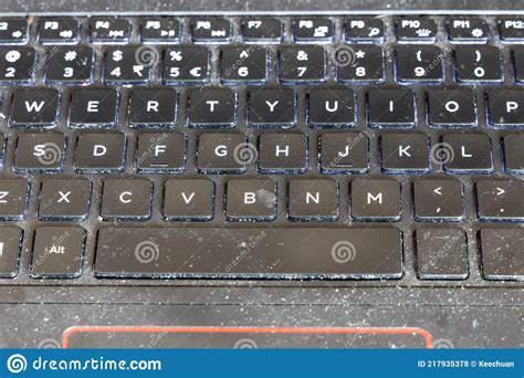 Close Up On Dirty And Unhygienic Computer Laptop Keyboard Full Of Dust