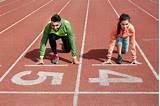 Young man and woman at starting line before a race - Stock Photo - Dissolve