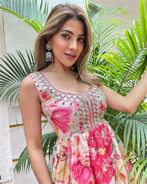 Nikki Tamboli Gives Bombshell Vibes In Pink Ruffled Saree With Deep