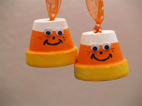 Then place the peppermint candies in a single layer (that's important) inside the cookie cutters. Candy Corn and Bat Halloween Ornaments - Housewife Eclectic