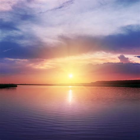 Sunset Over Water Stock Photos Pictures And Royalty Free Images Istock