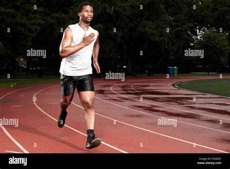 Young Man Sprinting On Track Stock Photo Alamy