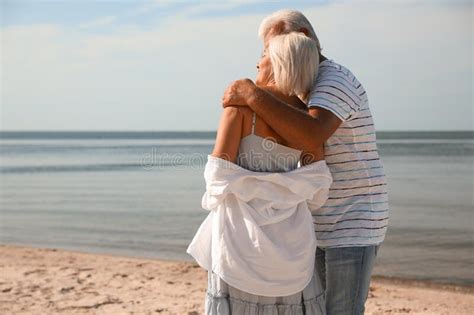 mature couple spending time together on beach back view stock image image of beach seaside