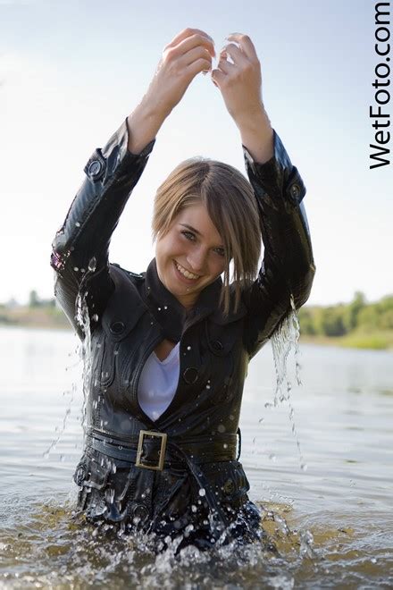 Fully Clothed Girl In Tight Jeans And Shoes Get Soaking Wet And Have Fun At Lake Wetfoto