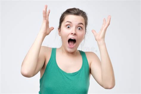 Surprised Young Woman In Green Clothes Shouting Shocked With Great News