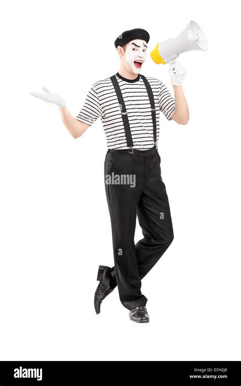 Full Length Portrait Of A Male Mime Artist Speaking At Loudspeaker And