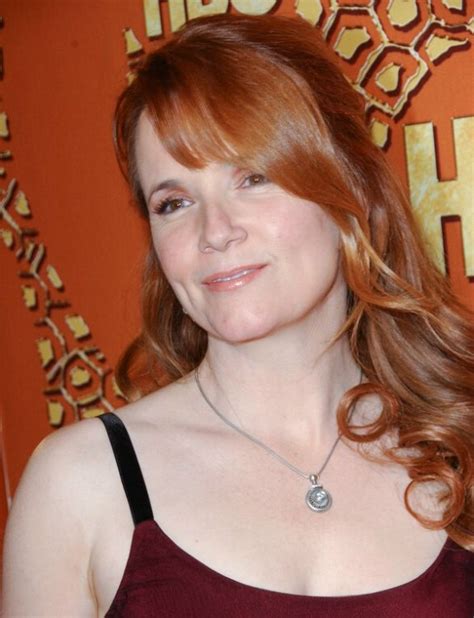 Lea Thompson With Her Long Red Hair Worn Over To One Side And With Curls